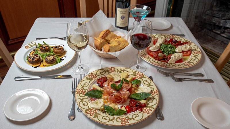 Multiple appetizers with focus on antipasto appetizer